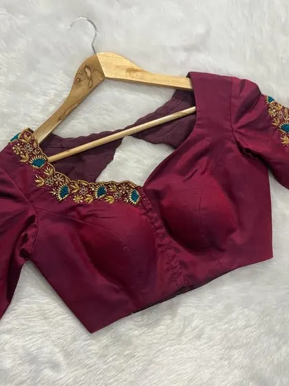 The intricate embroidery on the sleeves and neckline makes this a truly special piece.
