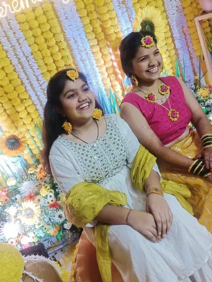 Smiles and laughter at a Haldi function. The bright yellow theme makes for very happy pictures.