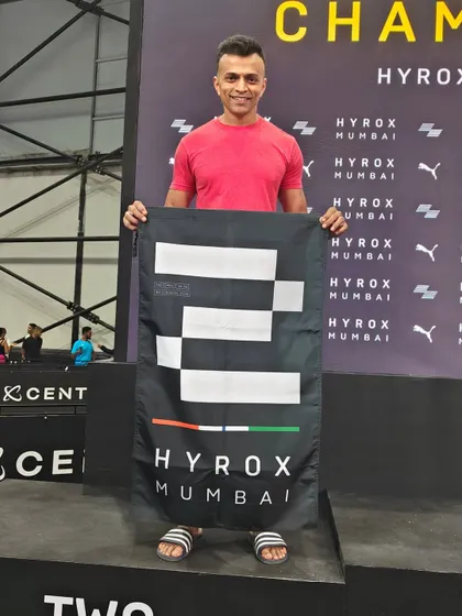 Head Coach Nishanth celebrating his 2nd place podium finish in the Men's Pro division at HYROX Mumbai.