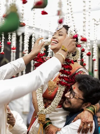 Pure, uninhibited laughter from the bride during a playful wedding ritual. These are the candid moments that become the most cherished memories.