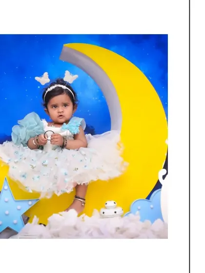 Another angle from the 'Moon & Stars' theme, showing the complete setup with cloud and star props. I ensure every detail contributes to the magical feel of the portrait.