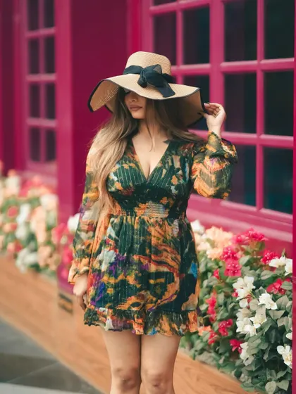 This colorful backdrop feels like a street in London. We used the vibrant location to complement the floral dress, creating a cheerful and stylish fashion portrait.