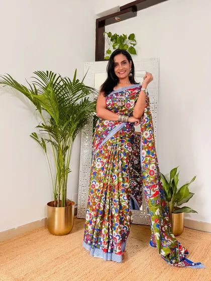 Look at the vibrant colors on this cotton mulmul Kalamkari saree. It's so cheerful and perfect for adding a pop of color to your day. The fabric is breathable and ideal for Indian weather.