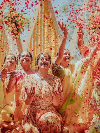 Another shot of the incredible petal shower, capturing the excitement and happiness of the moment.