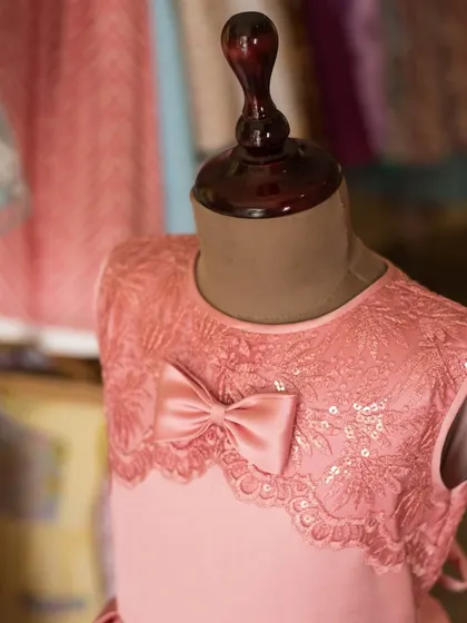 A closer view of the pink lace and satin bow, highlighting the different textures and the quality of the materials I use.