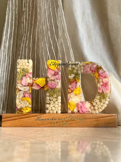 Turn your precious blooms into a stunning custom monogram LED lamp. This 'HD' lamp was made using a wedding garland and looks beautiful when lit up on its engraved wooden base.