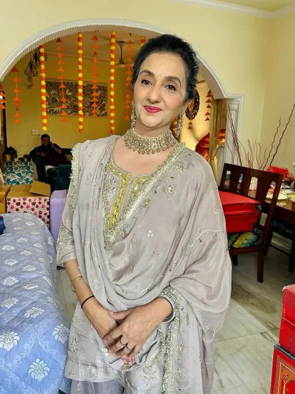 The client looking directly at the camera, her makeup looking fresh and beautiful.
