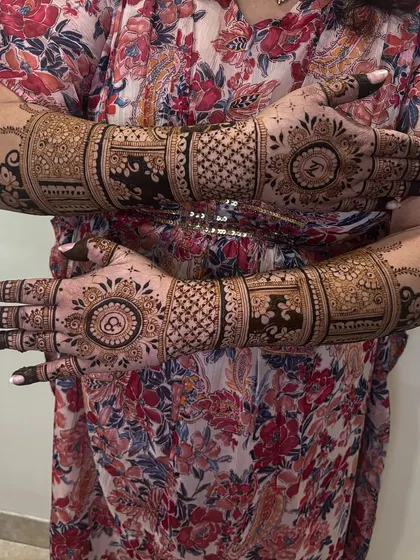 A view of both hands, showing the symmetrical back-hand design with personalized initials, ideal for showing off that new ring.