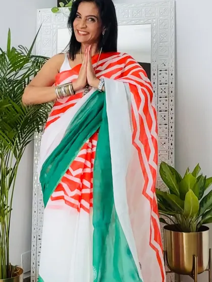 This saree with saffron and green stripes is a bold and graphic representation of the tricolor. It's a fun and modern take on patriotic dressing.