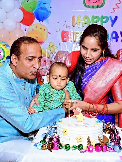 The cake-cutting moment is always special. Here, Devjit's parents help him cut his star-themed cake at his Cocomelon first birthday party at home.