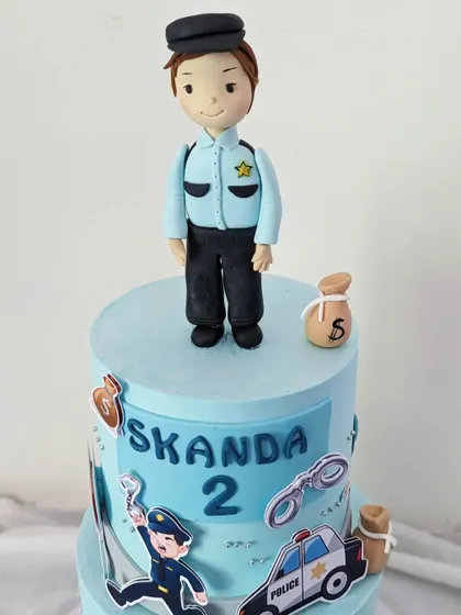 A close-up of the fondant policeman figurine, which was the centerpiece of the cake.