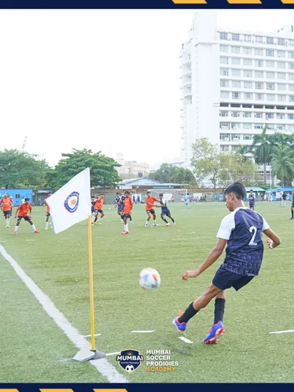 A player takes a corner kick during a crucial semi-final match.