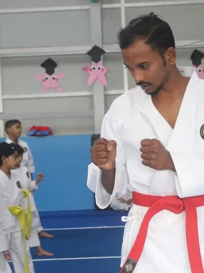 As an instructor, I demonstrate the correct form and intensity required during a belt exam, ensuring our standards of excellence are clear to every student.