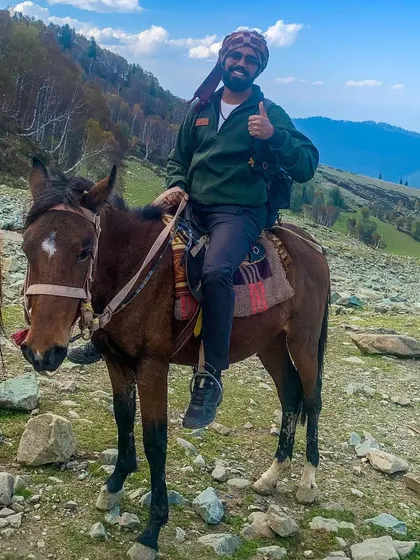 A moment of gratitude with my four-legged companion, Badal, during a 21-kilometer horse ride in the mountains of Kashmir. Adventures like these are a vital part of our fitness philosophy.