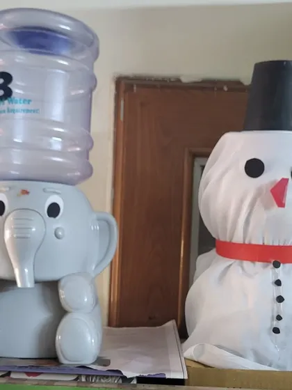 Even our water dispenser got a festive friend! A handmade snowman adds a touch of holiday cheer to every corner of the library.