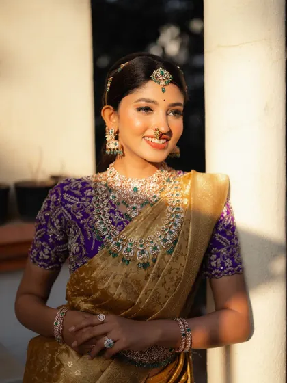 The golden hour light hitting the bride creates a beautiful, warm glow. This portrait feels dreamy and magical, highlighting her happiness.
