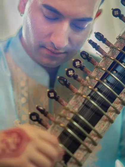A close-up during a private performance for the Ambani family's Ganesh Chaturthi celebration. For exclusive family functions and religious ceremonies, I provide a bespoke musical experience that is both deeply traditional and personally meaningful.