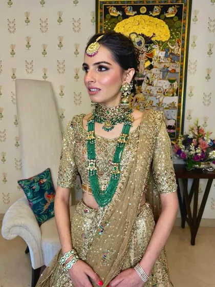 A poised and elegant portrait of the bride, her hair neatly styled to showcase her beautiful features.