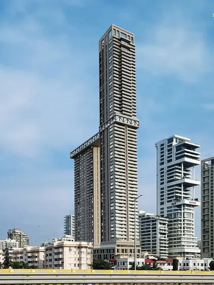 This residential tower in South Mumbai stands as an urban masterpiece against the city skyline. The design connects two structures with a dramatic sky bridge, creating a powerful architectural statement that blends functionality with high-design.