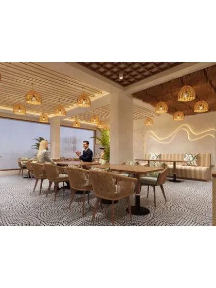 A wide view of the bohemian-style cafe, showing the spacious layout, ample natural light, and consistent use of natural materials.