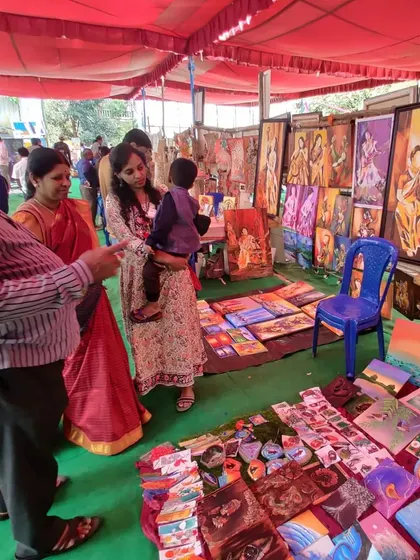 Duplicate of 105, showing my family and customers at my art stall.