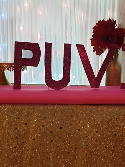 Personalization is key, and for Puvi's party, I created this custom glitter cutout of her name. Placed on the cake table, it adds a special and personalized element to the main stage decor.