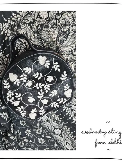 Art on art. Our patron Meghana created this beautiful flat-lay of her Wednesday Sling in our Lace Galaxy edit. The white embroidery on the black metallic leather looks stunning against the similarly patterned fabric.