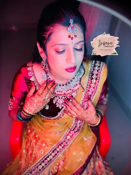 A close-up of a glamorous reception look. The focus is on the eyes and a bold lip, paired with diamond-style jewellery for a truly stunning effect.