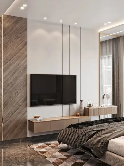 A view of the TV wall in the bedroom, continuing the chevron wood paneling theme for a cohesive and elegant look.