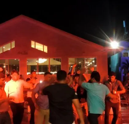 The Godrej team enjoying their outdoor party under the stars.