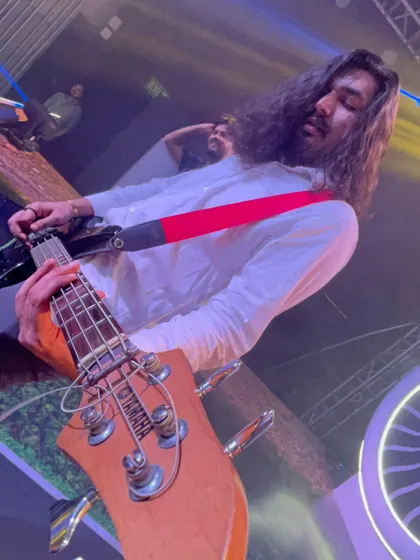 A close-up of our bassist, completely in the zone. Teamwork makes the dream work.