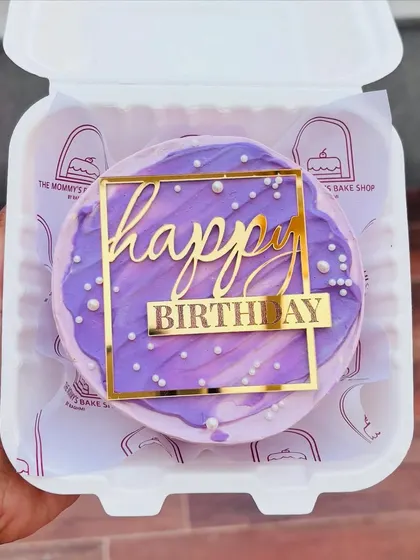 A purple marble-effect bento cake with a gold acrylic "Happy Birthday" topper. Simple, yet so elegant.