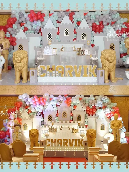 A duplicate of image 100, showing the full castle stage and the themed dining table in the foreground.