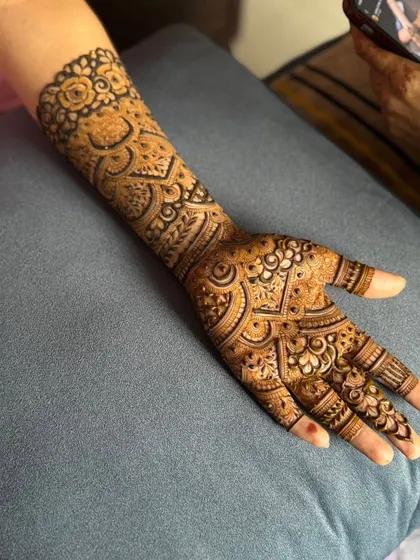 This is a detailed view of my intricate bridal henna work. Each design is unique, combining traditional patterns like paisleys and mandalas with fine-line fillers to create a stunning, full-coverage look for your special day.