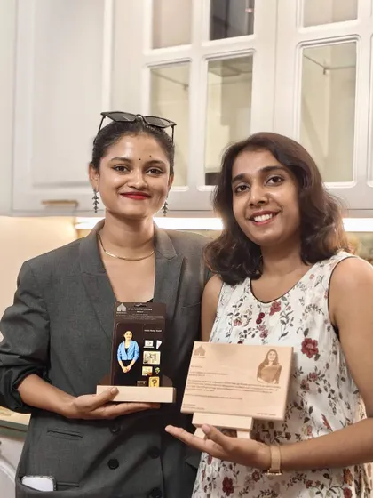 Mancy and Akshaya proudly holding their anniversary awards. Their passion and dedication enrich our team culture.