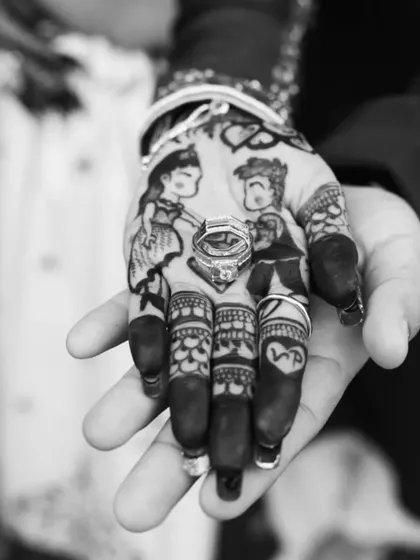 A truly unique way to capture the proposal moment. This design features a caricature of the groom proposing, with the actual engagement ring placed perfectly in the drawing. The couple's initials are on the fingers.