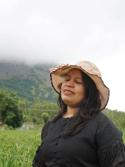 A guest enjoying the peaceful ambiance and lush greenery at our Nandi Hills resort. It's the perfect place for a staycation.