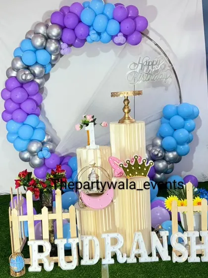 A purple, blue, and silver balloon ring, perfect for a simple and elegant celebration.