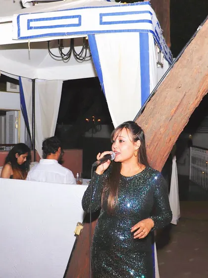 We often feature live music to enhance the dining experience. Here, a talented singer entertains guests, adding a soulful soundtrack to the evening.