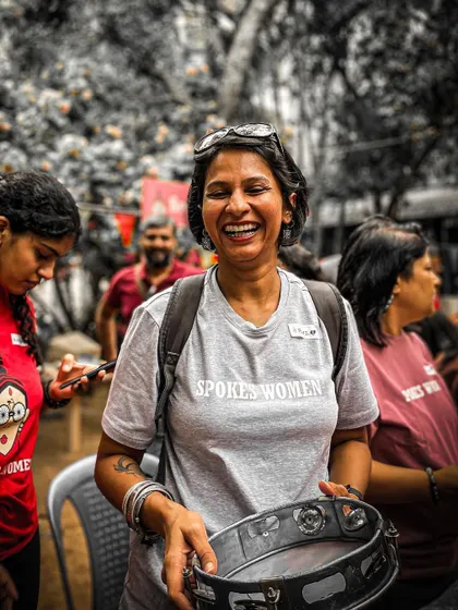 A member enjoying the tambourine during the drum circle. The joy on her face says it all.