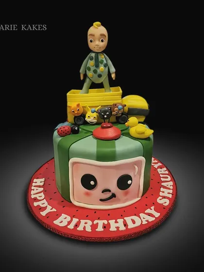 This Cocomelon cake was one of my most challenging deliveries, all the way to Soom Tea estate! The cake features a 3D fondant JJ on top of the classic melon design.