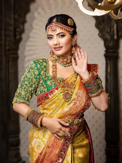 This detailed photoshoot showcases a complete South Indian bridal look, from the intricate matha patti and layered necklaces to the flawless airbrush makeup and traditional saree draping.