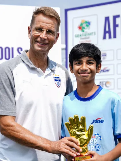A young goalkeeper receives the Golden Glove award from a BFC legend. We celebrate individual excellence as well as team success.
