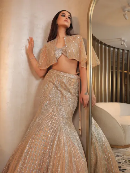 This full-length shot shows how the makeup and outfit create a complete, show-stopping look. The glam is perfect for a cocktail or reception event.