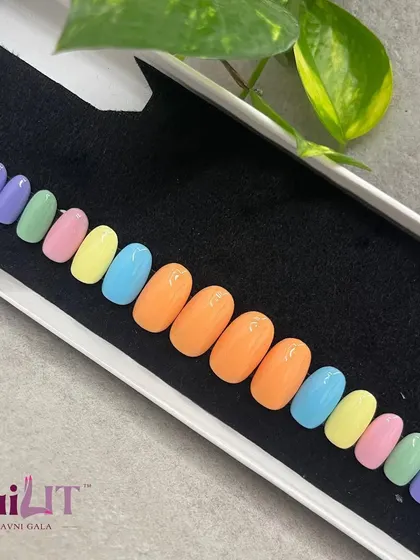 A full set of pastel rainbow nails, ready to go. This kit offers a simple yet super fun look with a different soft color on each nail.