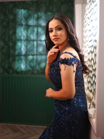 A close-up portrait in the blue fish-cut gown, perfect for capturing your party look.