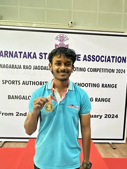 Darren with his gold medal from the Air Pistol Men's team event.