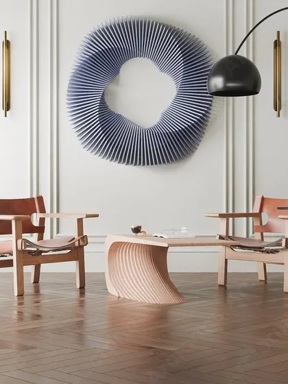 This full-room shot shows the wavy blue sculpture as the centerpiece of a sophisticated, modern living area.