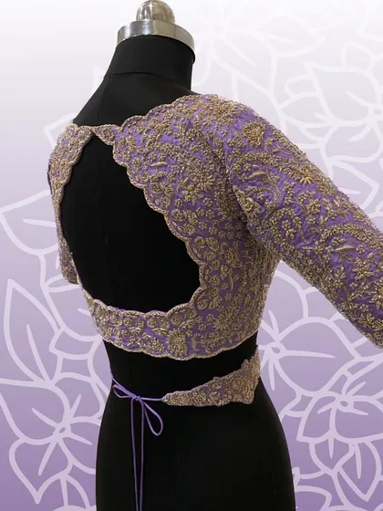 The back of the lavender blouse, featuring a beautiful cutwork design.