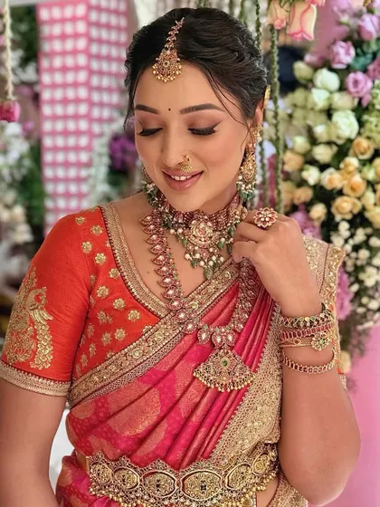 The makeup is rich and defined, perfect for a bride who wants to make a statement.